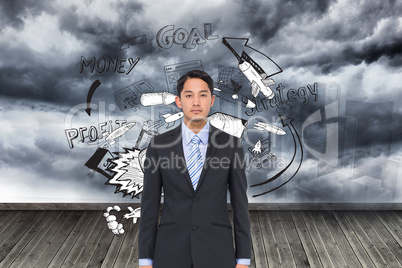 Composite image of serious asian businessman