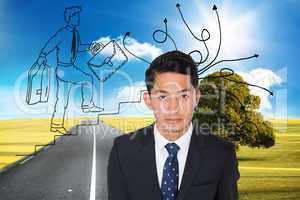 Composite image of serious asian businessman