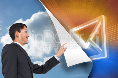 Composite image of smiling asian businessman pointing Composite image of smiling asian businessman pointing