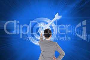 Composite image of asian businesswoman pointing