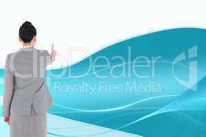 Composite image of asian businesswoman pointing