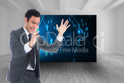 Composite image of excited businessman catching