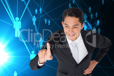 Composite image of smiling asian businessman pointing