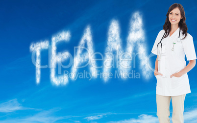 Composite image of confident and smiling woman doctor standing i