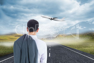 Composite image of businessman standing