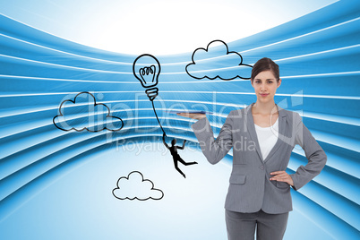 Composite image of smiling businesswoman holding tablet pc