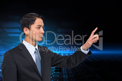 Composite image of stern asian businessman pointing