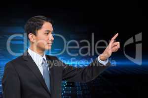 Composite image of stern asian businessman pointing