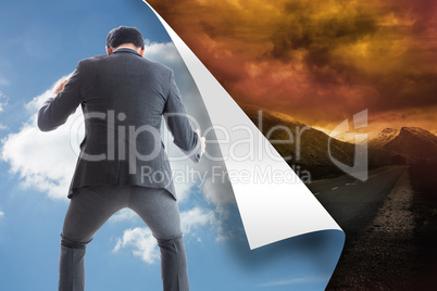 Composite image of businessman catching