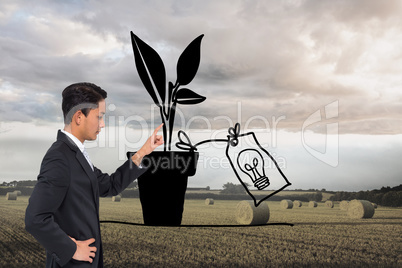 Composite image of unsmiling asian businessman pointing