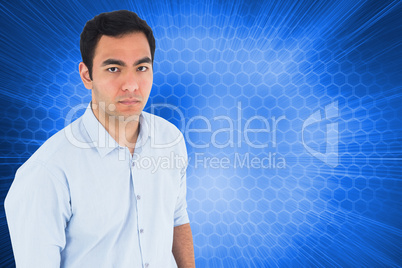 Composite image of unsmiling casual man standing