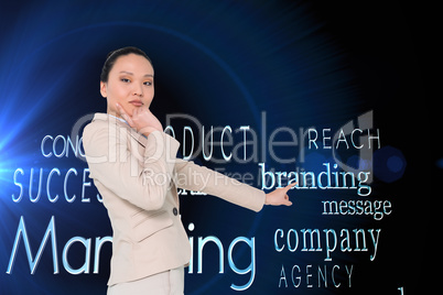 Composite image of thoughtful asian businesswoman pointing Composite image of thoughtful asian businesswoman pointing