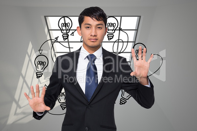 Composite image of unsmiling businessman touching