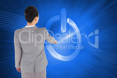 Composite image of asian businesswoman pointing