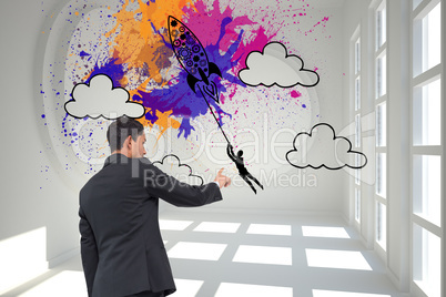 Composite image of serious asian businessman pointing