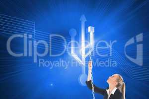 Composite image of businesswoman pulling a chain