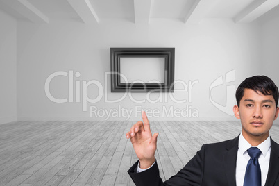 Composite image of unsmiling businessman touching