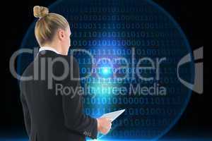 Composite image of businesswoman holding tablet