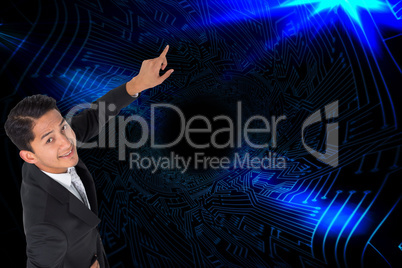 Composite image of smiling asian businessman pointing