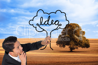 Composite image of thoughtful asian businessman pointing