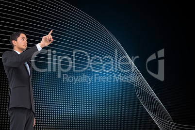 Composite image of serious asian businessman pointing