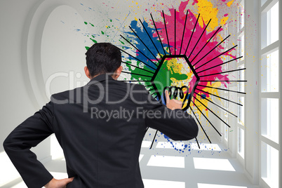 Composite image of asian businessman pointing