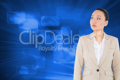 Composite image of unsmiling asian businesswoman