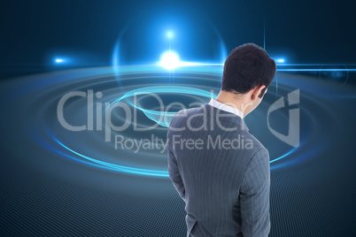 Composite image of businessman standing