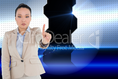 Composite image of unsmiling asian businesswoman pointing