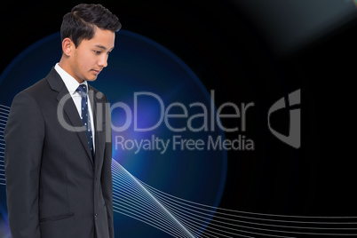 Composite image of serious attractive asian businessman