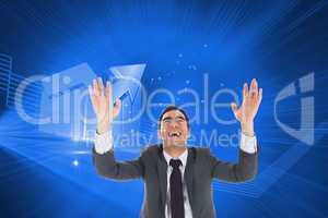 Composite image of excited businessman with arms raised