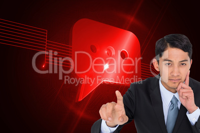 Composite image of thoughtful asian businessman pointing