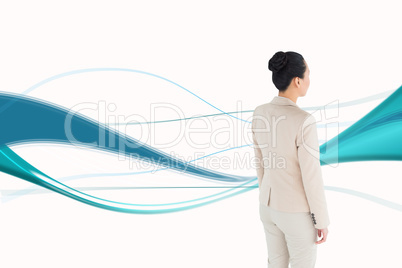 Composite image of asian businesswoman walking