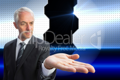 Composite image of concentrated businessman with palm up