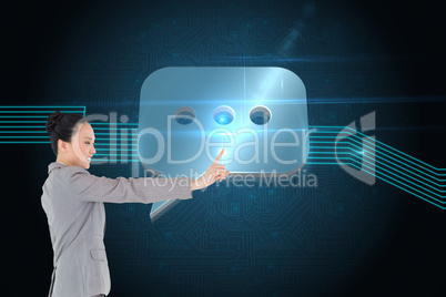 Composite image of smiling asian businesswoman pointing