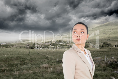 Composite image of unsmiling asian businesswoman