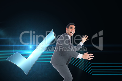 Composite image of happy businessman catching