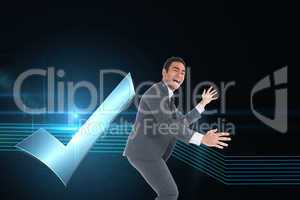 Composite image of happy businessman catching