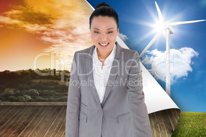 Composite image of smiling asian businesswoman pointing