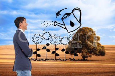 Composite image of smiling casual businessman with arms crossed