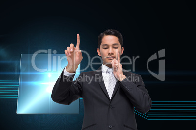 Composite image of thoughtful asian businessman pointing