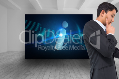 Composite image of thoughtful asian businessman pointing