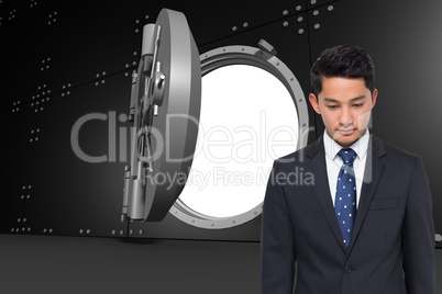 Composite image of serious asian businessman