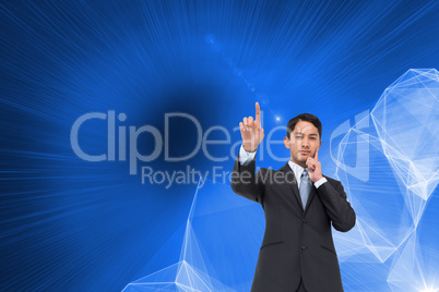 Composite image of thoughtful asian businessman pointing