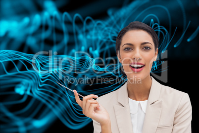 Composite image of smiling businesswoman holding a pen