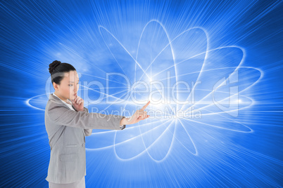 Composite image of thoughtful asian businesswoman pointing