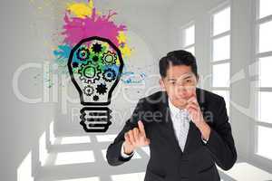 Composite image of thoughtful asian businessman pointing