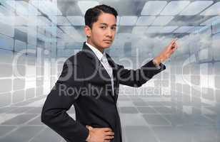 Composite image of unsmiling asian businessman pointing