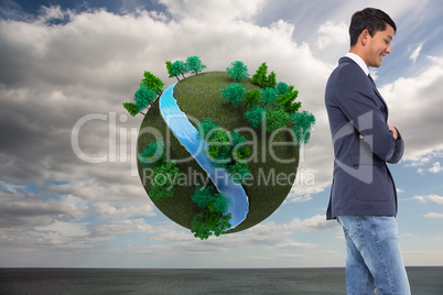 Composite image of smiling casual businessman with arms crossed Composite image of smiling casual businessman with arms crossed