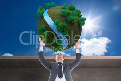 Composite image of unsmiling businessman with arms raised